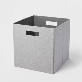 A 13-inch Brightroom™ fabric storage bin in a light gray color, showcasing its square shape and cut-out handle on the side for easy carrying.