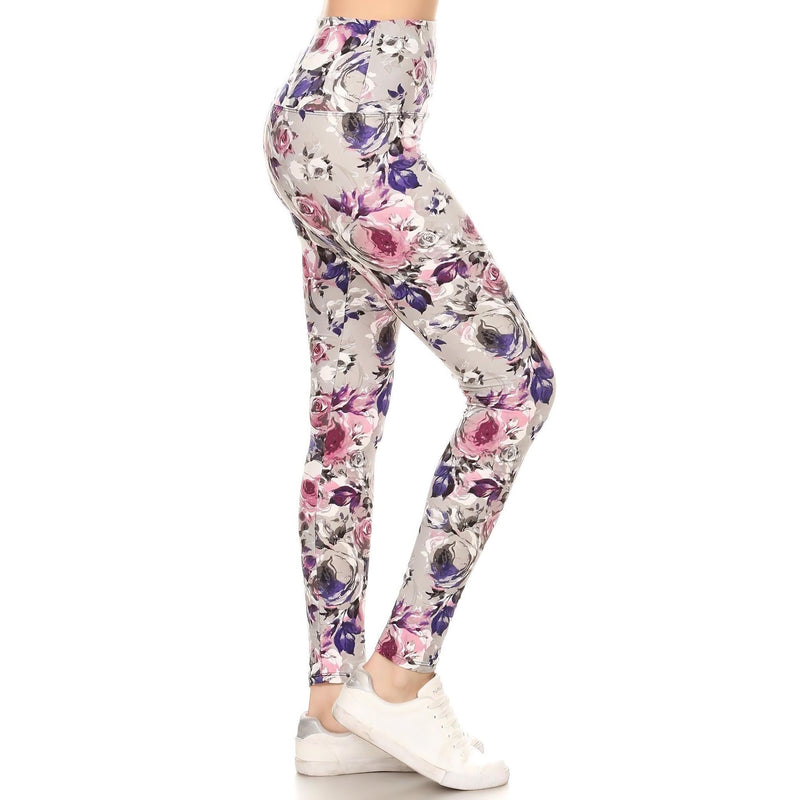 Load image into Gallery viewer, Side view of high-waist yoga leggings showcasing the vibrant floral pattern with shades of pink and purple, perfect for both gym sessions and leisure.
