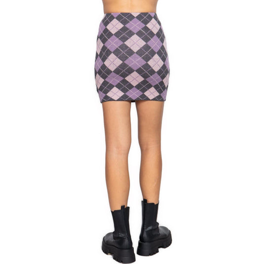 Rear view of a model wearing a Charcoal and Pink Argyle Jacquard Sweater Mini Skirt, displaying the consistent pattern and fit around the waist and hips.