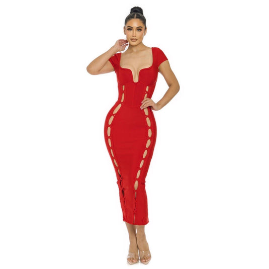 A model in a striking red Bandage Midi Slit Bodycon Dress with a sculpted wired neckline and side lace-up detailing, paired with clear high heels.