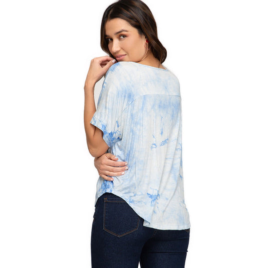 Rear view of a stylish blue tie-dye knit top featuring a relaxed drop shoulder silhouette and a subtle V-neckline, exuding casual elegance.