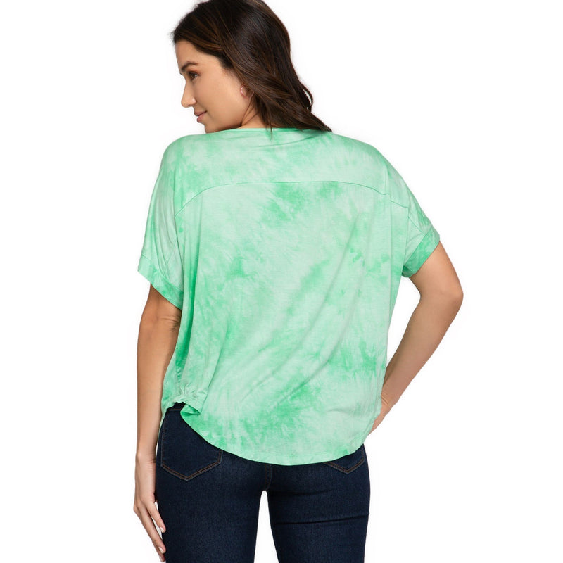 Load image into Gallery viewer, Backside of a light green tie-dye V-neck top highlighting a loose drop shoulder cut, seamlessly blending comfort with contemporary style.
