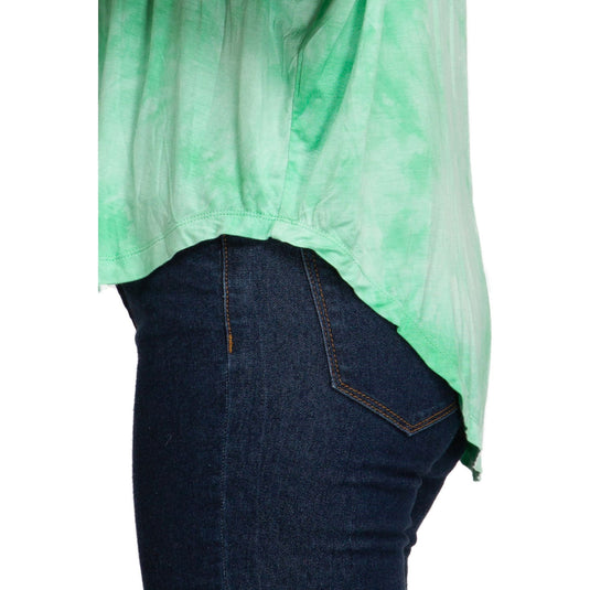 Close-up side view of a light green tie-dye top with drop shoulders, showcasing the top's flowy design, high low hem, and soft fabric texture.