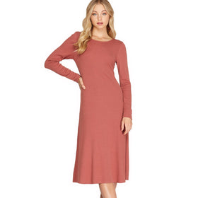 Elegant dusty coral colored long sleeve midi dress with a round neckline, crafted from a soft knit fabric, presenting a simple yet sophisticated silhouette perfect for versatile styling.