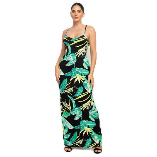 Front view of a chic black maxi dress adorned with vibrant green tropical leaves, ideal for a statement summer wardrobe piece.