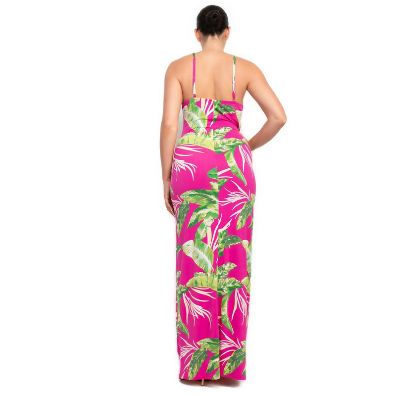 Load image into Gallery viewer, Back view of a fuchsia bodycon maxi dress with green tropical leaf print, perfect for summer parties and beach getaways.
