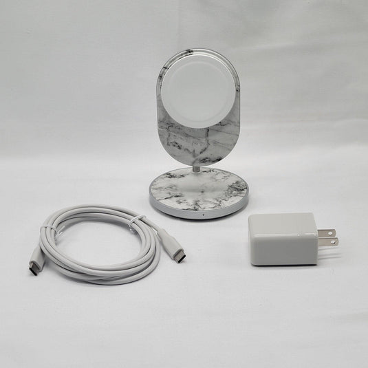 A MagSafe wireless charging stand with Qi charging base, displayed with a USB-C cable and power adapter, set against a white surface.