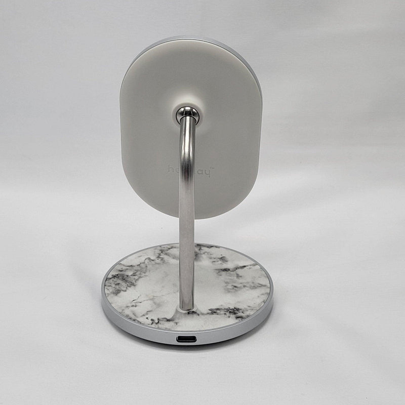 Load image into Gallery viewer, Rear view of a MagSafe wireless charging stand featuring a gray marbled design with a metallic arm and a Heyday logo on the back, against a white backdrop.
